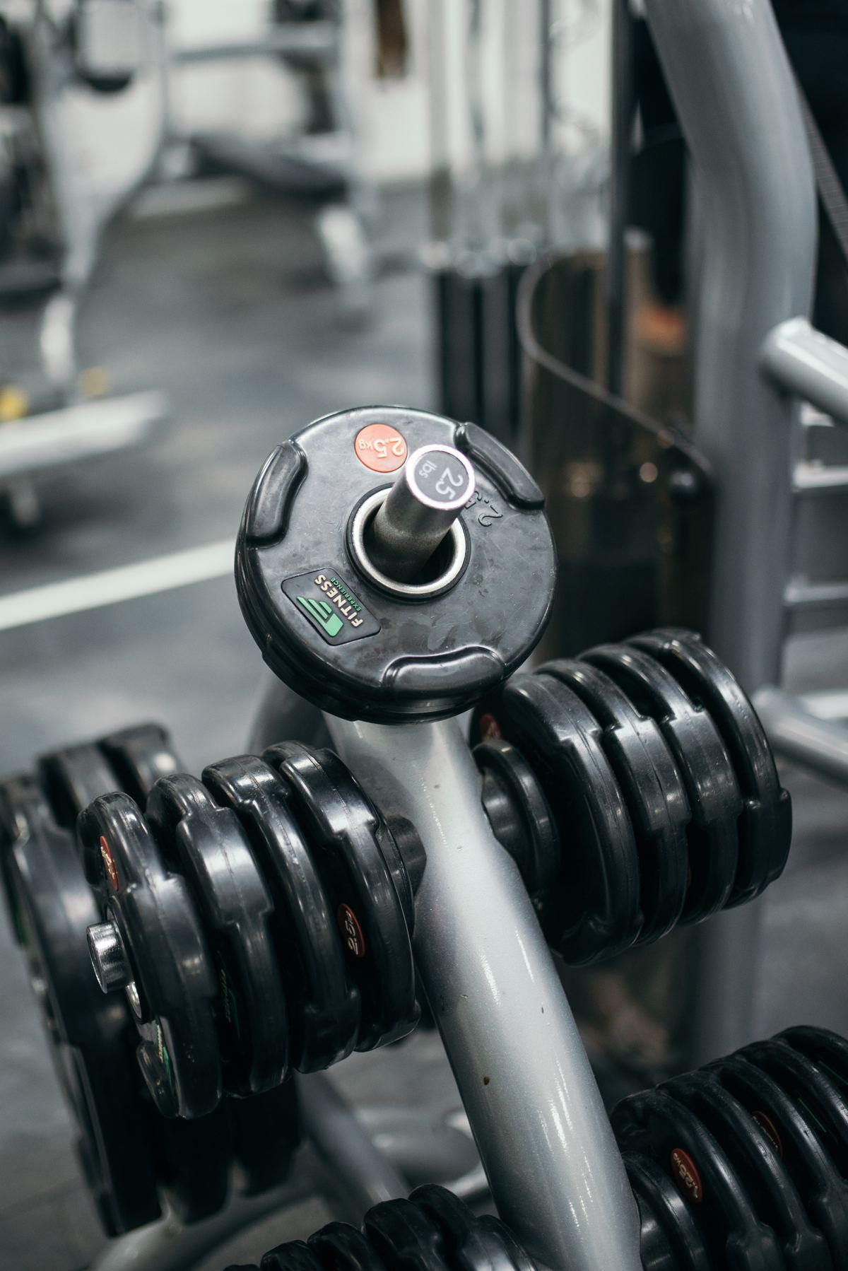 Close-up of heavy dumbbells on a rack